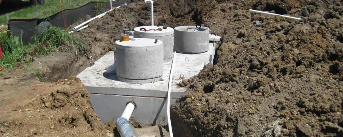 Septic system repair and installation site with tank access ports in Durham, NC