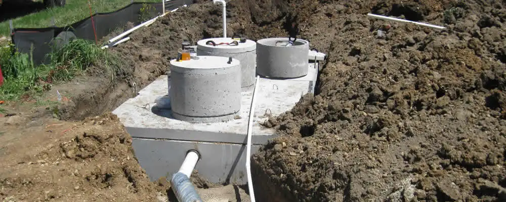 Septic system repair and installation site with tank access ports in Durham, NC