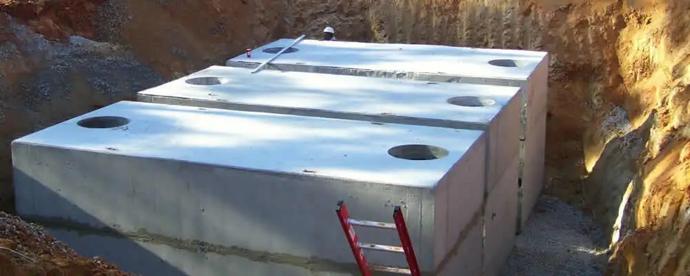 Septic tank installation site with a newly placed concrete tank in Durham, NC